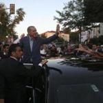 Turkey's Prime Minister Tayyip Erdogan waved to the crowd as he departed his home in Istanbul Sunday. 