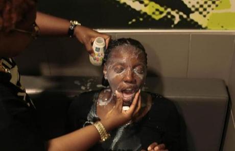 A woman had her face doused with milk after suffering from the effects of tear gas.
