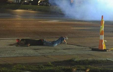 A protestor was in pain after being shot by a rubber bullet during a protest in Ferguson.
