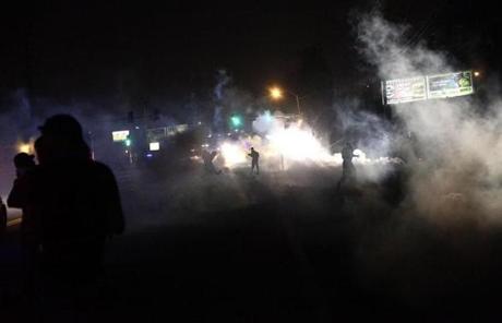 Police attempted to push them back by firing tear gas, shouting over a bullhorn that the protest was no longer peaceful.
