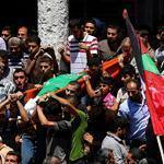 Palestinians carried the body of the wife of Mohammed Deif in the northern Gaza Strip on Wednesday.