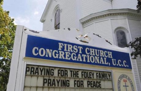 A sign outside the First Church Congregational in Rochester, N.H., called for prayers for Foley's family.
