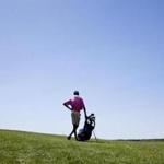 7/29/14 Nantucket Mass. Kevin Williams waits by his golfer's bag on Tuesday, July 29, 2014 at Nantucket's Sankaty Head Golf Club. (Zack Wittman for the Boston Globe)