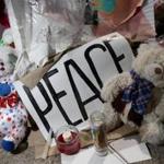 A peace sign was tucked among teddy bears in a memorial created for Michael Brown in the spot where his body lay.