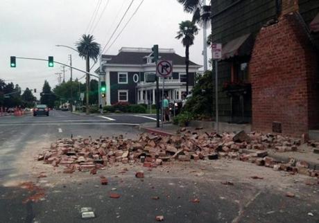 Bricks were in a street after a building was damaged during an earthquake in Napa, Calif.
