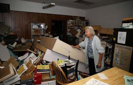 Jean Meehan looked over damage at her stamp and collectible store in Napa.
