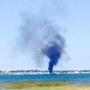 Smoke billowed from a boat that caught fire in Provincetown Harbor on Sunday.