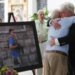 John Foley, James Foley?s father, received a hug after Sunday afternoon?s Mass.