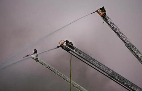 Firefighters used ladders to battle the blaze.
