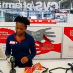  Cashier Ruth Jean, 19, rings up a sale at a CVS in Boston in front of signs that deliver the company?s antismoking message. Jessica Rinaldi/Globe Staff 