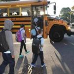Students boarded a school bus Thursday morning on Old Colony Avenue in South Boston.