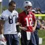 Tight end Rob Gronkowski (87) and quarterback Tom Brady (12) are listed as questionable for Sunday?s season opener. (AP Photo)