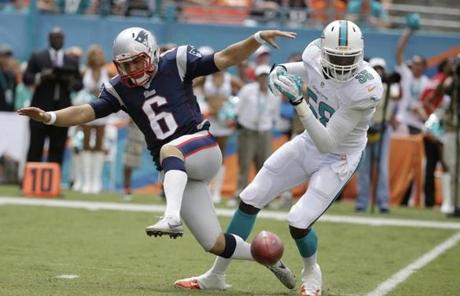 Miami Dolphins linebacker Chris McCain blocked a punt return by New England.
