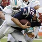 Patriots quarterback Tom Brady was sacked four times by the Dolphins in Sunday?s loss.