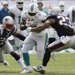 Patriots such as Darrelle Revis (left) and Patrick Chung had trouble keeping Knowshon Moreno under control Sunday. Lynne Sladky/Associated Press