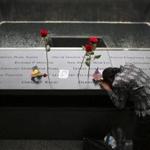 A woman grieved at her husband?s inscribed name at the Sept. 11 memorial in New York.
