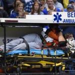 Marlins right fielder Giancarlo Stanton is carted off the field after getting hit in the face by a pitch in the fifth inning. Benny Sieu-USA TODAY Sports