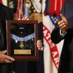 President Obama (right) applauded after he awardded the Medal of Honor posthumously to Army Specialist Four Donald P. Sloat.