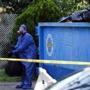 Workers in hazmat suits removed bags of waste from Erika Murray?s home in Blackstone on Sunday. 