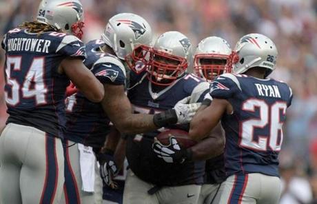 Vince Wilfork?s interception sealed the win for the Patriots.
