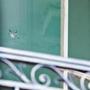 In this 2011 file photo, a bullet hole is seen in the window on the residential level on the south side of the White House.