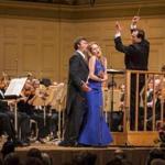 Andris Nelsons, in his debut as BSO music director Saturday night, performing with soprano Kristine Opolais and tenor Jonas Kaufmann.