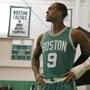 Boston Celtics guard Rajon Rondo posed with his broken hand in a cast at media day in Waltham.