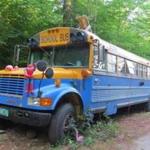 Making a cross-country road trip memorable, the author reserved stays in a school bus (where the family slept) in Thorton, N.H.