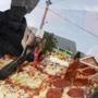 Anthony Valenti used sheers to cut up a slice of pizza at the Topsfield Fair.  