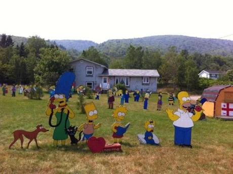 Since 2005 Sylvia Googoo has cut out and painted the cast of ?The Simpsons? and arrayed them around her house in Nova Scotia, a delightful surprise for travelers.
