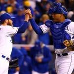 Greg Holland of the Kansas City Royals celebrates with catcher Salvador Perez after closing out the ninth inning to defeat the Baltimore Orioles.  (Photo by Dilip Vishwanat/Getty Images)