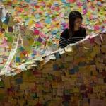 Prodemocracy notes covered a stairwell in Hong Kong. Police staged a dawn raid on Friday on students camped at the Mong Kok protest site.