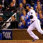 Omar Infante watches his two-run shot to left field that capped the Royals? five-run sixth inning. (Dilip Vishwanat/Getty Images)