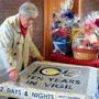 Parishioner Pat McCarthy put an anniversary quilt on a table.