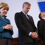 Martha Coakley and Charlie Baker bowed their heads in prayer next to Rev. Burns Stanfield at a Greater Boston Interfaith Organization Forum in Boston on Sunday. 