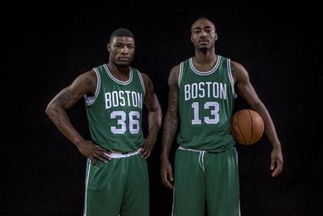 Draft picks Marcus Smart (left) and James Young should add youthful vigor and 3-point prowess Photo by Nick Laham/Getty Images
