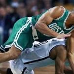 Celtics guard Avery Bradley (top) and Brooklyn?s Jarrett Jack hit the floor during the first half. (Globe Staff Photo/Jim Davis) 