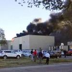 In the image from video provided by KAKE News black smoke billows from a building at Mid-Continent Airport where officials say a plane crashed Thursday, Oct. 30, 2014 in Wichita, Kan. AP Photo/KAKE News) MANDATORY CREDIT