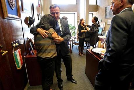 Boston City Councilor Sal LaMattina hugged City Hall employee Nicole Leo in the council offices as City Council President Bill Linehan looked on.

