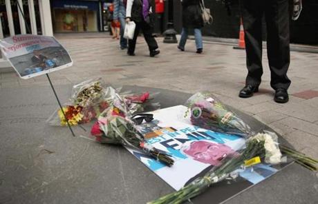 Flowers and signs were seen at the memorial for the former Boston mayor.
