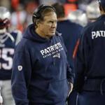 New England Patriots head coach Bill Belichick applauds as his team warms up before an NFL football game against the Chicago Bears on Sunday, Oct. 26, 2014, in Foxborough, Mass. (AP Photo/Elise Amendola)
