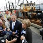 New Bedford Mayor Jon Mitchell (left) stood with Democratic candidate for governor Martha Coakley,as she answered questions from the media on City Pier 3.