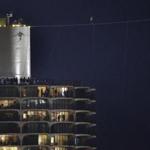 Daredevil Nik Wallenda walked on a tightrope between the Marina City west tower across the Chicago River to the top of the Leo Burnett Building on Sunday. 