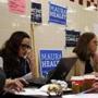 Volunteers worked the phones at a woman to woman phone bank for Martha Coakley in Cambridge last month. 