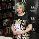 Actress Lena Dunham held her memoir, ?Not That Kind of Girl,? ahead of a book signing at Waterstones book shop in central London on Oct. 29.