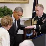President Obama presented the Medal of Honor posthumously to Army First Lieutenant Alonzo H. Cushing for conspicuous gallantry to Helen Loring Ensign (left). 
