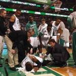 Concerned teammates gathered around Marcus Smart after he suffered an ankle injury in the fourth quarter Friday. 