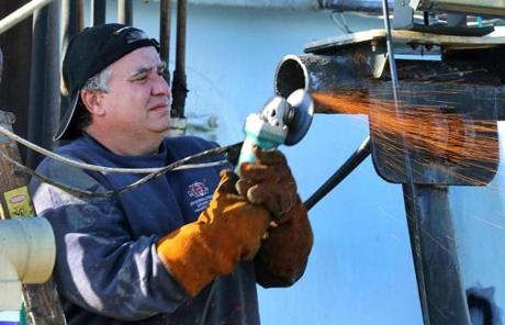 Joseph Orlando, a fisherman for 40 years in Gloucester, helped repair a friend?s trawler.
