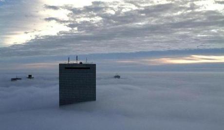 Boston was blanketed in fog Wednesday morning, as seen from the Prudential Tower.
