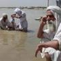Members of the Sabean Mandaeans take part in a bathing ritual on the Tigris River in Baghdad.